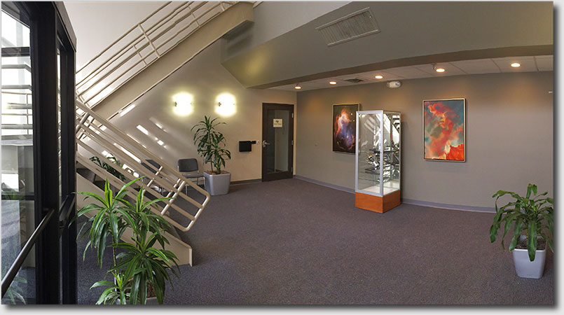 Suite entrance shown off foyer bathed in sunlight.